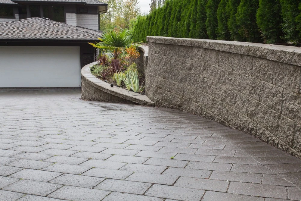 Driveway with plants and retaining wall