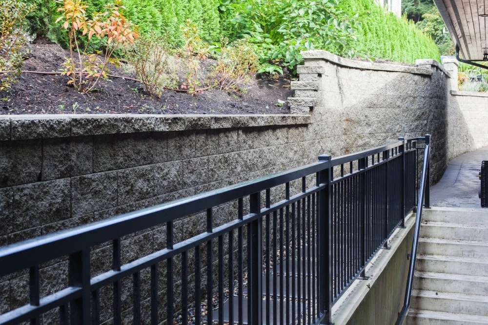 Retaining wall between plants and stone stairs