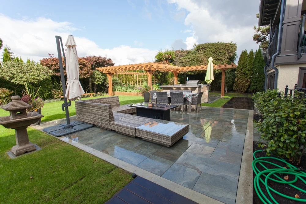 Custom outdoor kitchen connected to outdoor living area