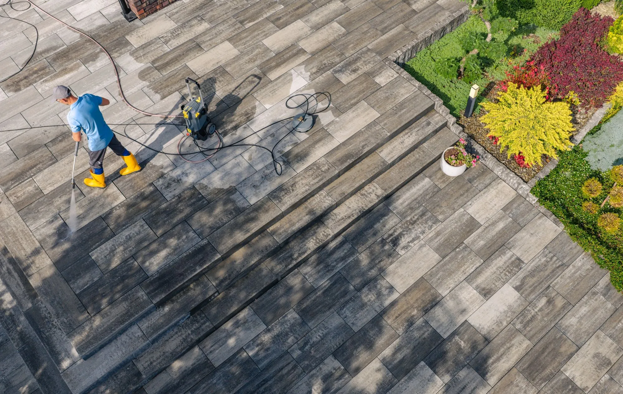 Preventing moss and algae buildup on Vancouver hardscaped surfaces