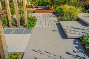 Natural stone and concrete paver patio surfaces compared in a Vancouver yard