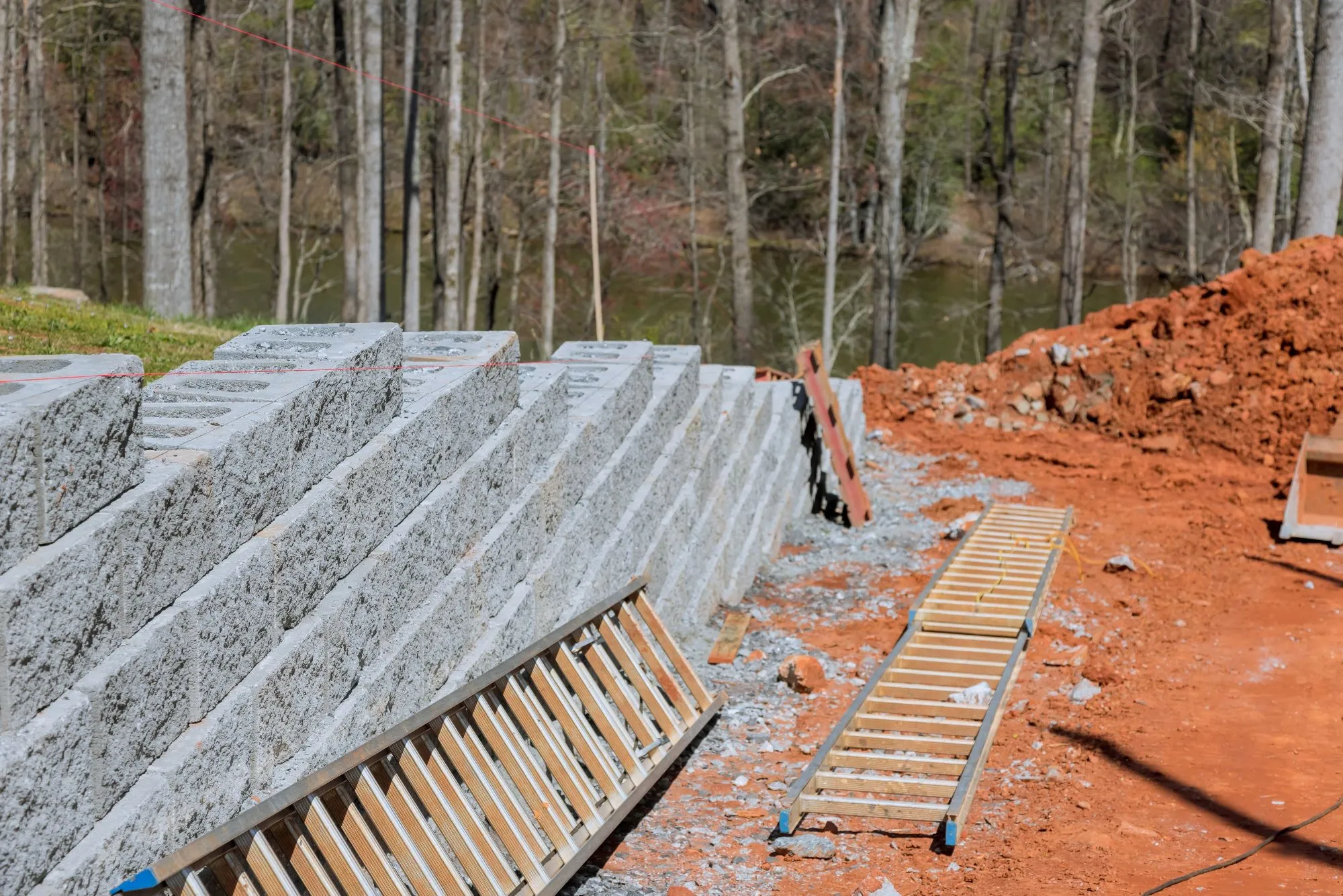 Leaning retaining wall showing visible movement and separation between wall sections