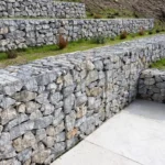 Retaining wall construction project in Vancouver showing excavation and wall installation